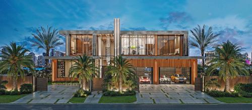 Modern waterfront luxury villa front elevation with glass facade and palm landscaping at sunset
